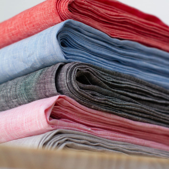 Yarn dyed linen chambray in five colourways – black, light blue, red, pink and grey – for dressmaking and considered summer sewing.