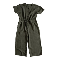 Green cassidy jumpsuit by Merchant and Mills on a white background
