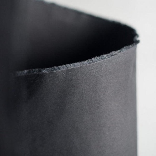 Organic Cotton Dry Oilskin in Black | Merchant & Mills designer sewing fabric | Stitch Piece Loop | Online Fabric & Sewing Supplies | A carefully curated range focusing on ethically produced & sustainable fabrics of the highest quality, perfect for the modern & considered sewist’s memade wardrobe | Australia
