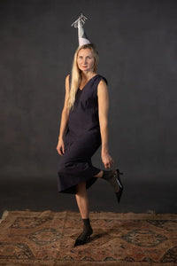 Woman wearing a dark Lilian Slip dress. The Lilian Slip Dress Sewing Pattern by Merchant and Mills available at Stitch Piece Loop Australia