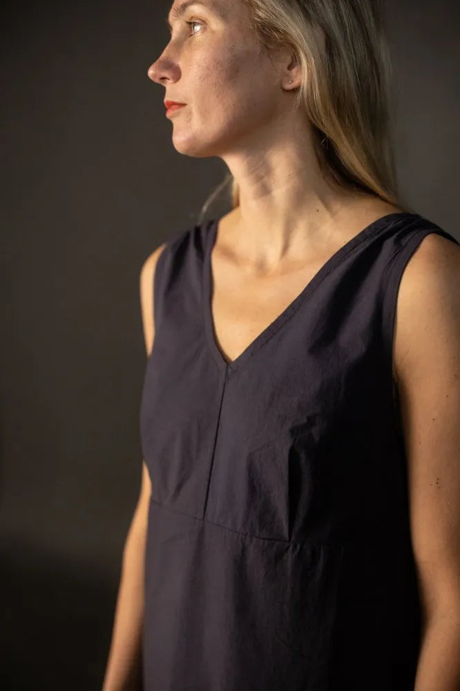 Woman wearing a dark Lilian Slip dress. The Lilian Slip Dress Sewing Pattern by Merchant and Mills available at Stitch Piece Loop Australia