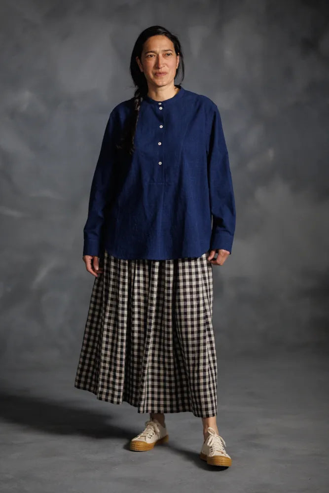 Woman wearing a dark blue Niven Shirt Dress - top version. The Niven Shirt Dress Sewing Pattern by Merchant and Mills available at Stitch Piece Loop Australia.
